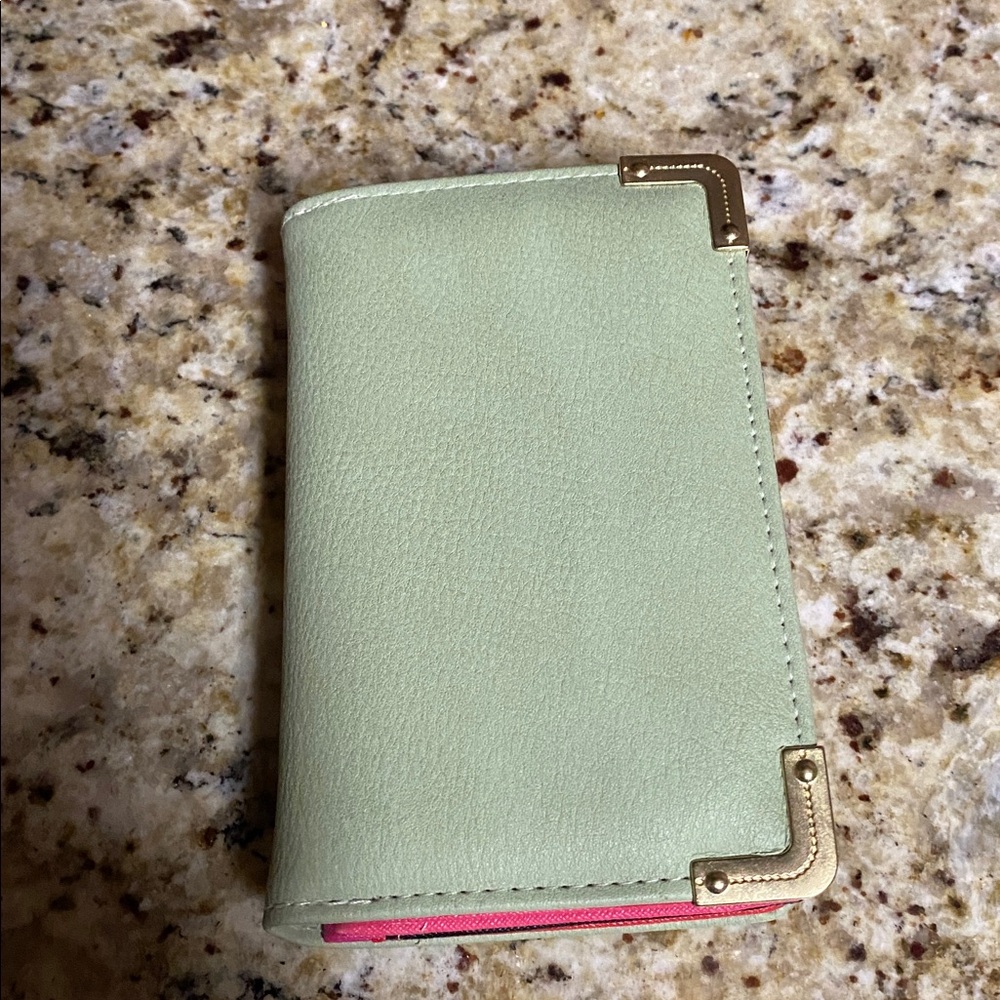 Mint Green Wallet with Gold Accents size 5 1/2 X 3 1/2.  Excellent condition.